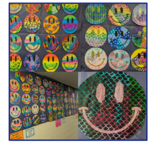 student created smiley faces inspired by Jartist immy Paintz hanging in our main hallway walls.